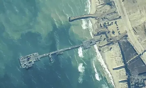 A key section of the U.S. military-built pier designed to carry badly needed aid into Gaza by boat has been reconnected to the Gaza beach following storm damage repairs and aid will begin to flow soon, the U.S. Central Command announced Friday. 