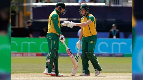 Bangladesh's Taskin Ahmed celebrates the dismissal of South Africa's captain Aiden Markram, partly seen on right, during the ICC Men's T20 World Cup cricket match between Bangladesh and South Africa at the Nassau County International Cricket Stadium in Westbury, New York, Monday, June 10, 2024.