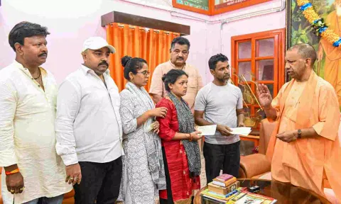  Uttar Pradesh Chief Minister Yogi Adityanath meets the family of an injured victim of Jammu terrorist attack (PTI)