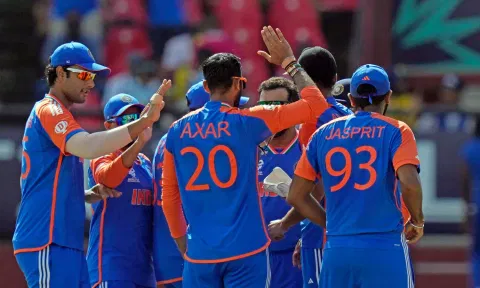 India's Axar Patel celebrates with teammates after the dismissal of England's captain Jos Buttler (PTI)