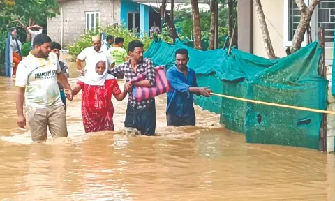 People being rescued from a flooded residential neighbourhood in The Nilgiris