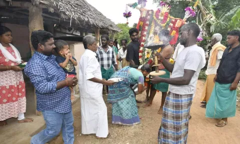 A Hindu family welcoming an ‘Allah Samy’ during Muharram in Kasavalavanadu Puthur village in Thanjavur on Wednesday