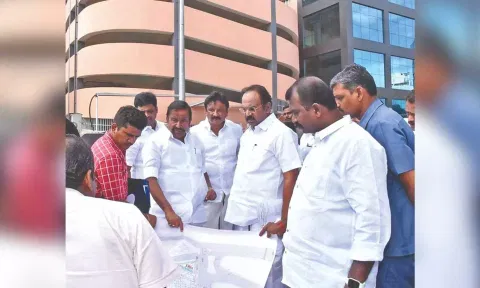 Ministers KN Nehru and Thangam Thennarasu taking stock of the ongoing works at Palayamkottai new bus stand in Tirunelveli on Sunday