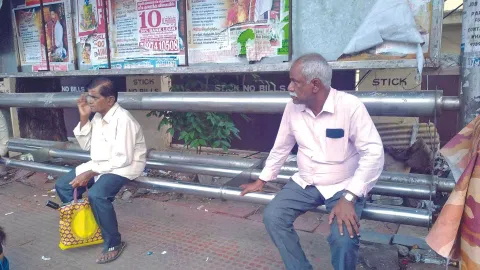  Broken seats at a bus shelter in Vepery
