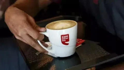Person have a Cafe Coffee Day drink 