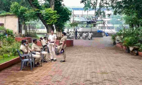 Police personnel deployed at the school in Badlapur a day after massive protests over alleged molestation of two school girls, in Thane (PTI) 