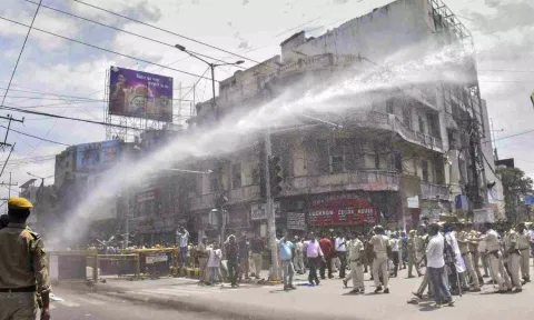  Police personnel use water cannon to disperse people protesting during the 'Bharat Bandh' called by SC/ST organisations over reservation issue (PTI)