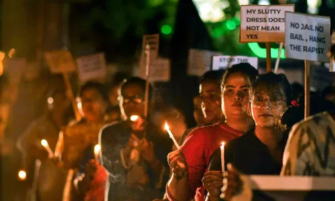  Women take part in a candlelight protest march against the alleged sexual assault and murder of a postgraduate trainee doctor in Kolkata