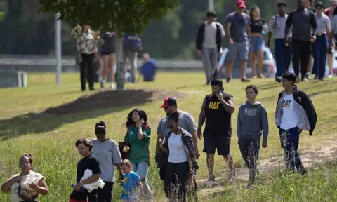 Students and parents walk off campus at Apalachee High School (AP) 