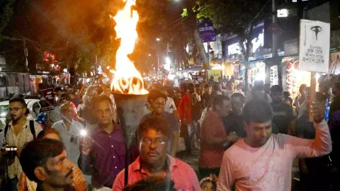 People take part in a protest march over the alleged sexual assault and murder of a trainee doctor (PTI)