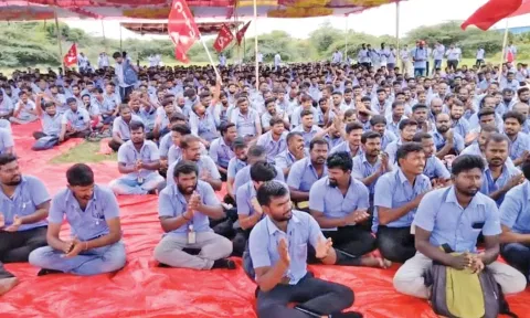 Striking workers of CITU-affliated Samsung Workers’ Union sitting on a protest on Monday
