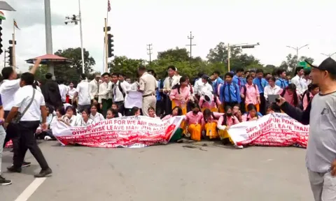 Students take part in a protest march against the recent violence in Manipur