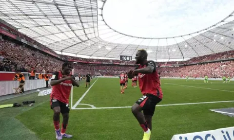 Bayer Leverkusen players celebrate after scoring a goal (AP)