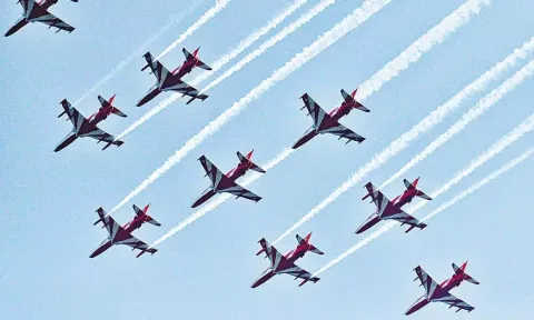  Suryakiran aerobatic display flies in formation during a flypast 