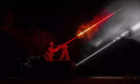 A Ukrainian serviceman of the 126th brigade air-defense unit fires by a machine gun during the training in Kherson region, Ukraine (AP)