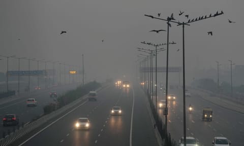 Vehicles move on a road amid low visibility due to smog, on Diwali, in New Delhi, Thursday night, Oct. 31, 2024. (PTI Photo)