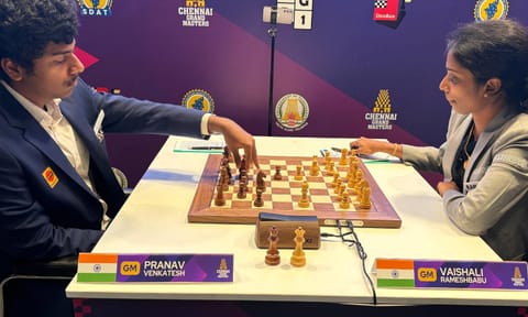 Pranav (L) makes a move against Vaishali (R) in the fourth round of Chennai Grand Masters 