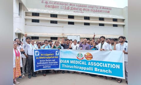 Doctors staging protest at GH in Tiruchy on Thursday 