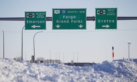 Road signage is posted just outside of Emerson, Manitoba (AP)