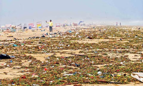 The Marina Beach shore was covered by trash after the storm which was cleaned by Corporation workers on Monday (Photo: Justin George) 