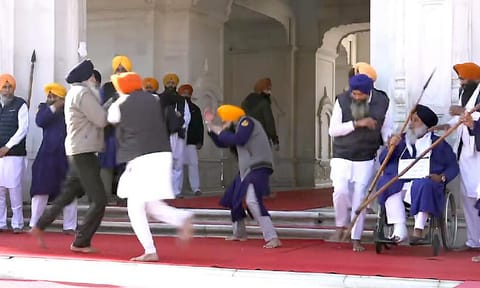 People catch a man who allegedly opened fire at Shiromani Akali Dal leader Sukhbir Singh Badal (PTI) 