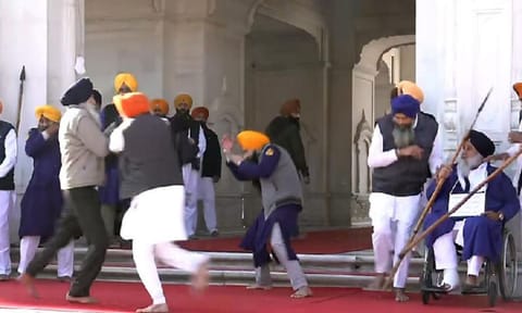 People catch a man who allegedly opened fire at Shiromani Akali Dal leader Sukhbir Singh Badal (PTI) 