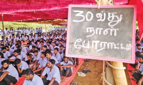 Striking workers of CITU-affliated Samsung Workers’ Union sitting on a protest 