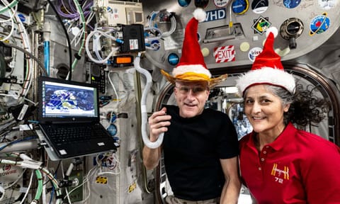 Don Pettit and Suni Williams pose for a fun holiday season portrait while speaking on a ham radio inside the International space station (X)