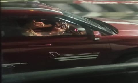 Person driving with alcohol in hand 