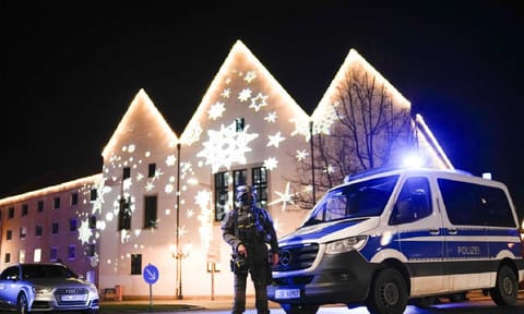 A police officer at the blocked road near Christmas market after the accident in Germany (AP)