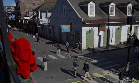 Members of the FBI walk around Bourbon street during the investigation of a truck fatally crashing into pedestrians on Bourbon street in the French quarter in New Orleans (AP) 