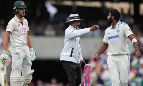 Umpire Sharfuddoula Saikat, centre, gestures to India's Jasprit Bumrah, right, as he exchanges words with Australia's Sam Konstas, left (AP)