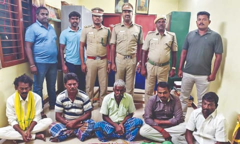 The arrested persons with the seized tusks 