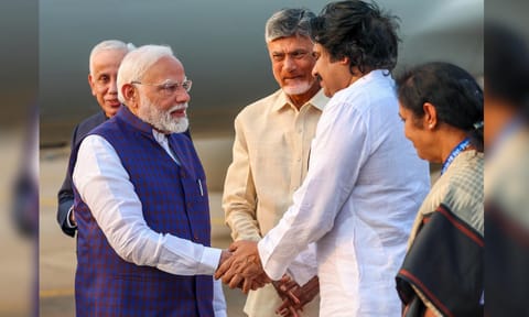Prime Minister Narendra Modi being received by Andhra Pradesh Deputy Chief Minister Pawan Kalyan upon his arrival, in Visakhapatnam, Andhra Pradesh (PTI) 