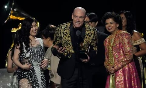 (L-R) Eru Matsumoto, Wouter Kellerman and Chandrika Tandon accept the award for best new age, ambient, or chant album for Triveni during the 67th annual Grammy Awards (AP)
