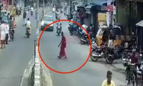 CCTV footage of elderly woman trying to cross the road before being hit by speeding car (Thanthi TV) 