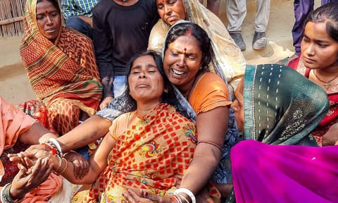 Family members of Neeraj Bhagdar, who died in a stampede that ocurred at the New Delhi railway station late Saturday night, mourn his death, at his native place in Vaishali district, Bihar (PTI) 