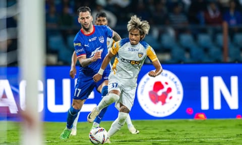 Chennaiyin's Jiteshwor Singh dribbles the ball past Bengaluru's Edgar Mendez