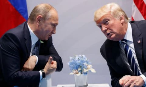 Vladimir Putin with Donald Trump (AP)