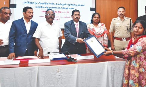 TN SC/ST commission chairperson S Tamilvanan distributes welfare assistance to a beneficiary, in Thanjavur, on Wednesday