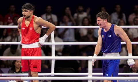  India's Nishant Dev (in red) looks on after lost against Alvarez Marco Verde of Maxico 