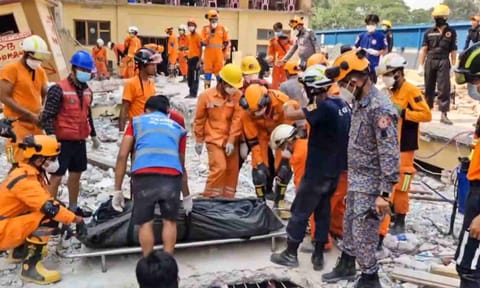  NDRF personnel conduct a rescue operation at the U Hla Thein Buddhist monastery following the recent earthquake, in Mandalay, Myanmar (PTI)