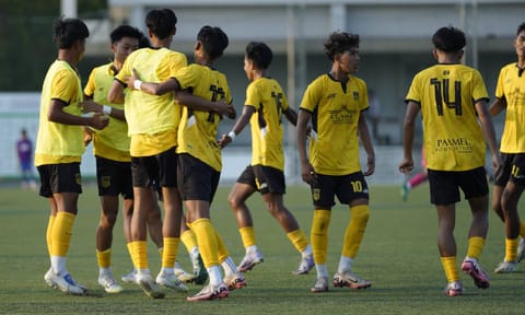 Classic FA players celebrate after scoring a goal 
