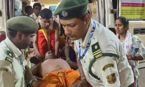 Police personnel carry an injured after a stampede during a temple festival, in Shirgao village, around 40 km away from Panaji, Goa, Saturday, May 3, 2025 (PTI) 