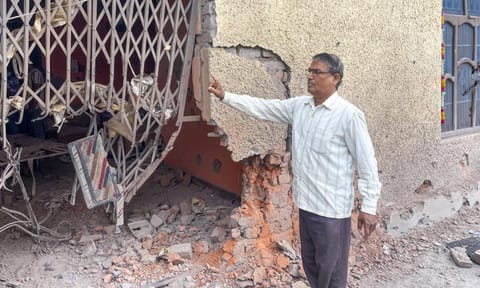 A civilian looks at damaged properties after heavy firing and shelling by Pakistan military overnight across the Line of Control and International Border, at Mendhar area of Poonch district, Jammu and Kashmir, Wednesday, May 7, 2025 (PTI) 