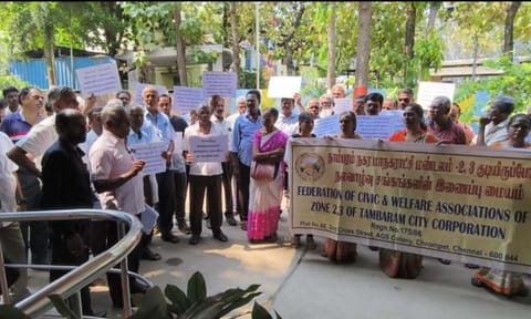 Residents protest outside Tambaram Corporation office on Monday 