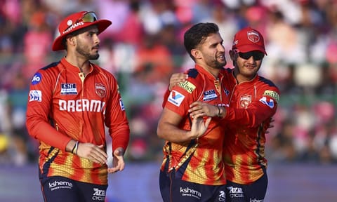 Punjab Kings' bowler Azmatullah Omarzai celebrates the wicket of Rajasthan Royals' batter Sanju Samson during the Indian Premier League (IPL) 2025 cricket match between Rajasthan Royals and Punjab Kings, at Sawai Mansingh Stadium, in Jaipur, Sunday, May 18, 2025 (PTI) 