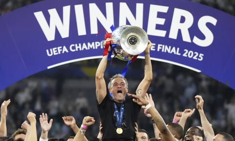 PSG's head coach Luis Enrique celebrates with the trophy after the Champions League final soccer match between Paris Saint-Germain and Inter Milan at the Allianz Arena in Munich, Germany, Saturday, May 31, 2025 (AP) 
