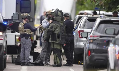 Law enforcement officials investigate after an attack on the Pearl Street Mall Sunday. 