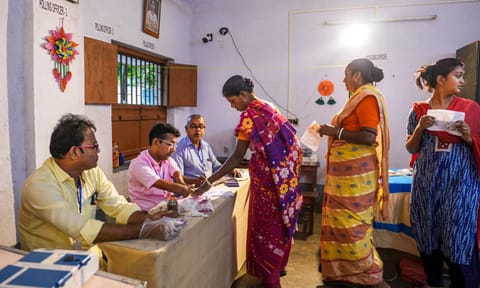  A voter makes a thumb impression before casting vote at a polling booth during the by-election to the Kaliganj assembly seat in West Bengal